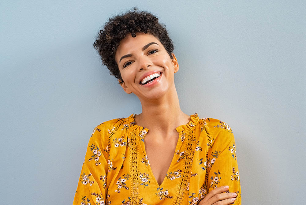 _0000_Cheerful african woman smiling